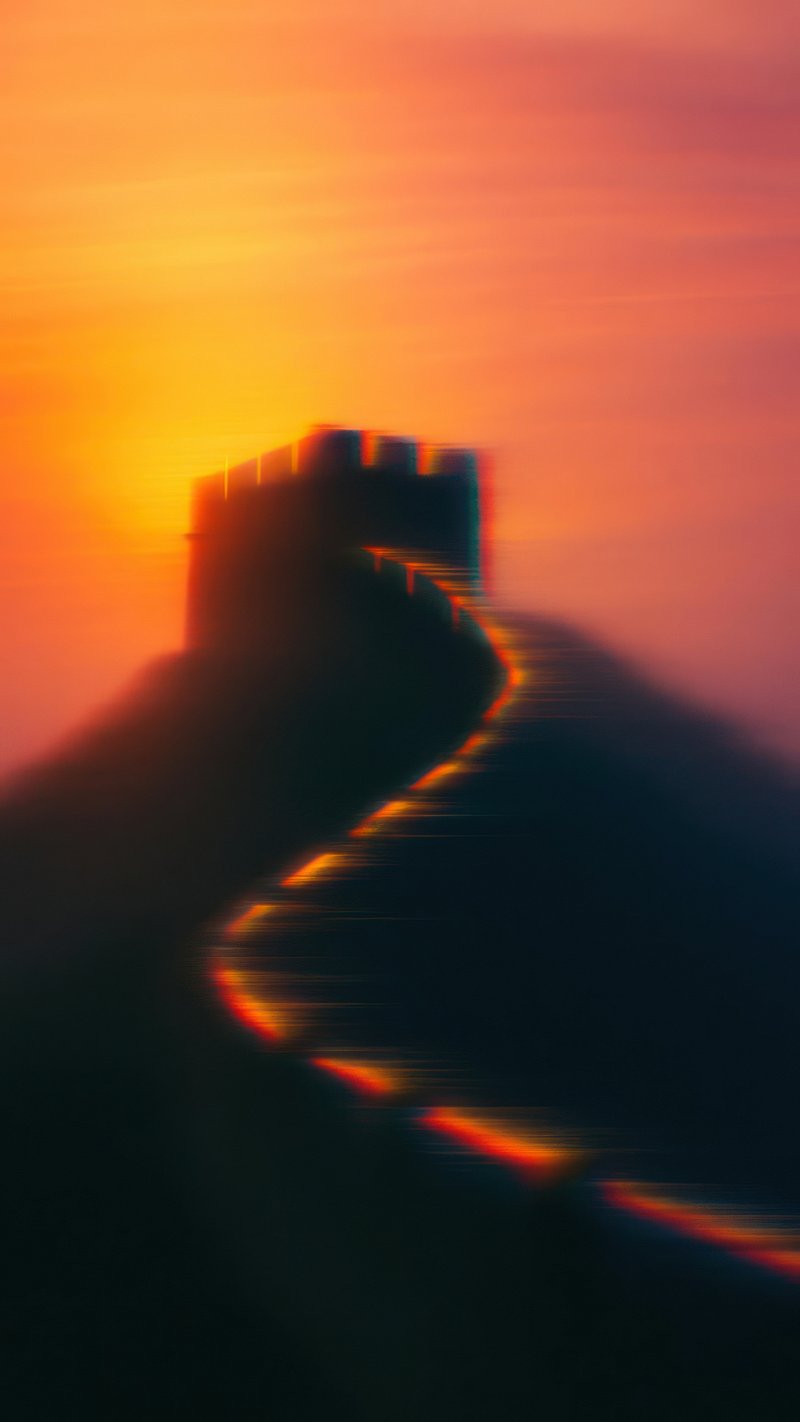 Vibrant sunset over ancient wall.