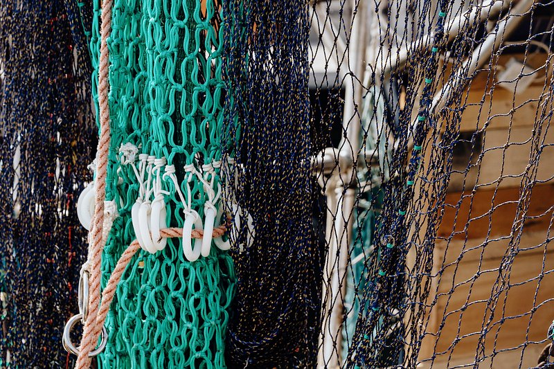 Used fishing nets on a pier. - a Royalty Free Stock Photo from Photocase