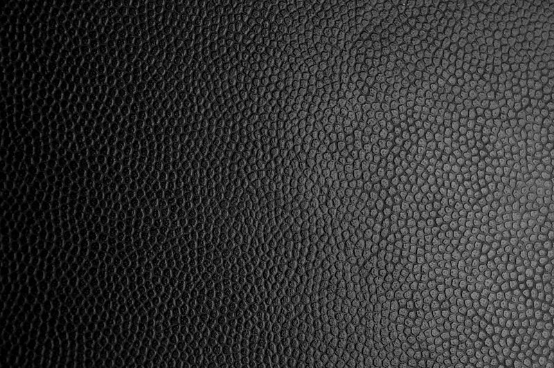 Premium AI Image  Black vinyl fabric with a textured pattern of the skin
