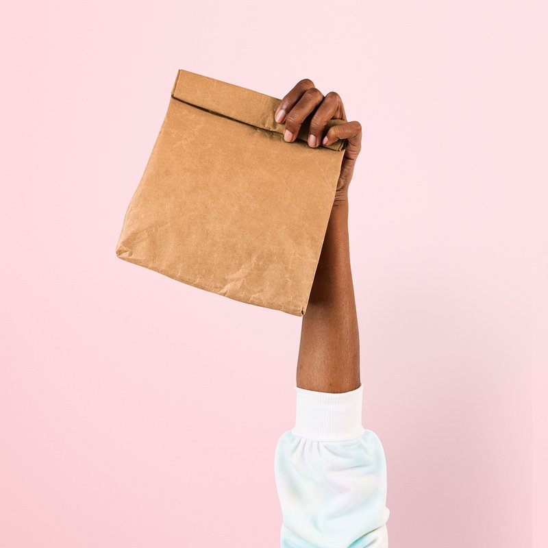 Premium Vector  Orange paper shopping bag mockup. blank craft purchase  package template isolated on white background