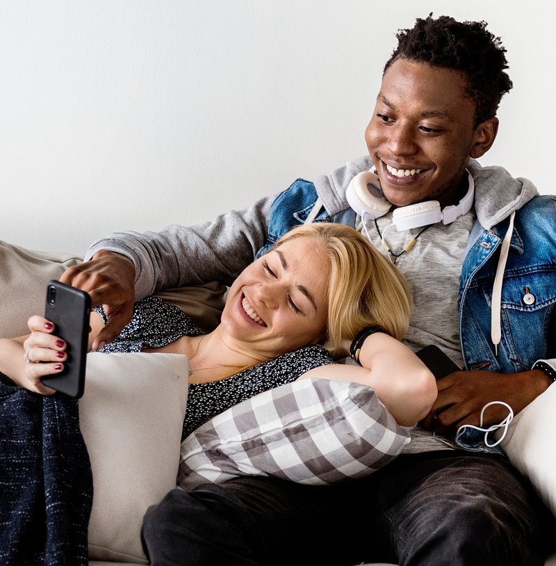 Cute Interracial Couple On A Couch Photo Rawpixel