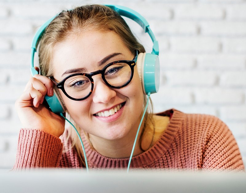 Positive man listening music with headphones, dancing on dark neon  background. Stylish student guy enjoying life, active energy, inspired  dance concept - a Royalty Free Stock Photo from Photocase