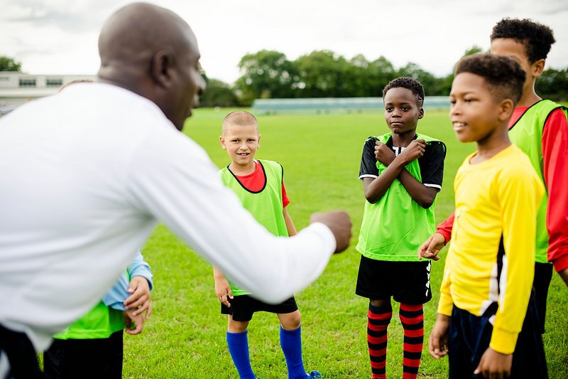 Football coach instructing his students | Free Photo - rawpixel