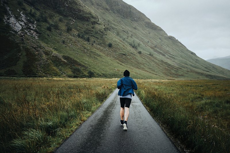 Running in the countryside. Power Walking. Man Power walk. Fat person Running in Mountains.