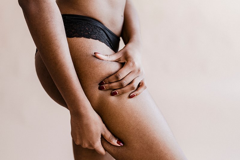 Premium Photo  Photo of attractive black woman wears black underwear  stands back. isolated over white background.