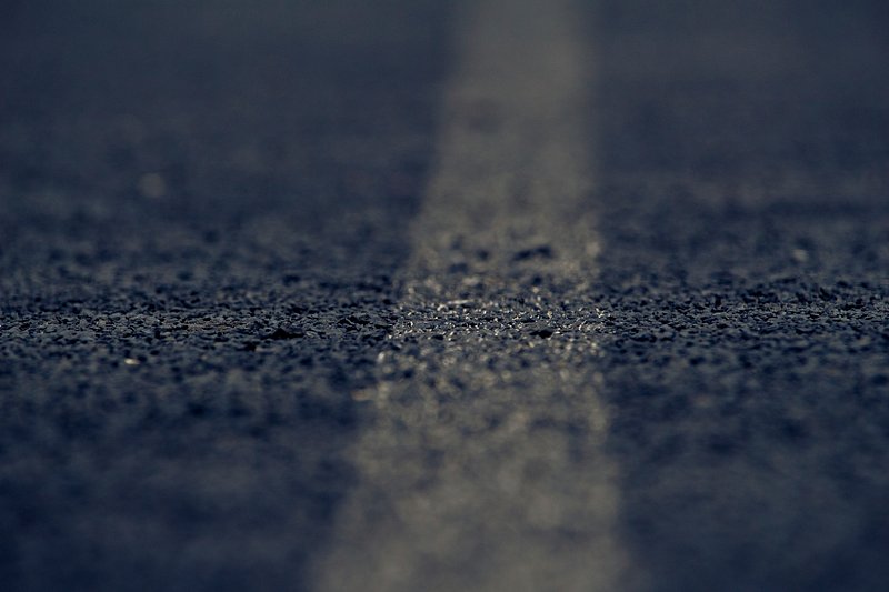 Texture of the road's gray asphalt as a background Stock Photo