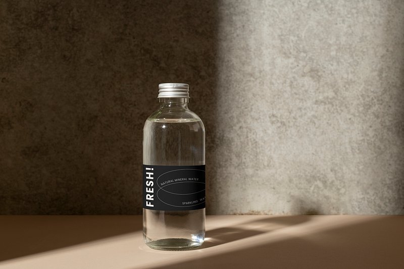 Mineral water in a clear glass bottle mockup Stock Photo by Rawpixel