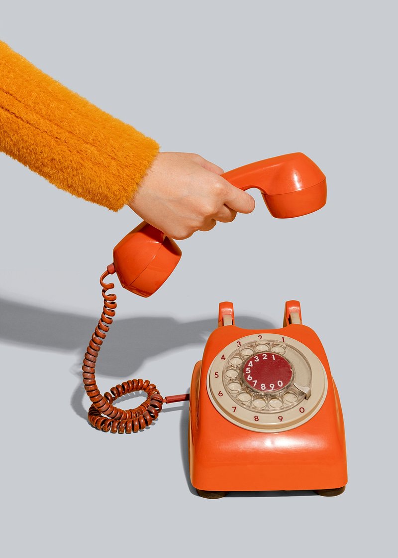 Vintage orange telephone white background
