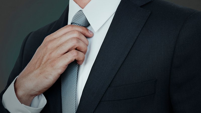 Businessman adjusting his tie | Premium PSD - rawpixel