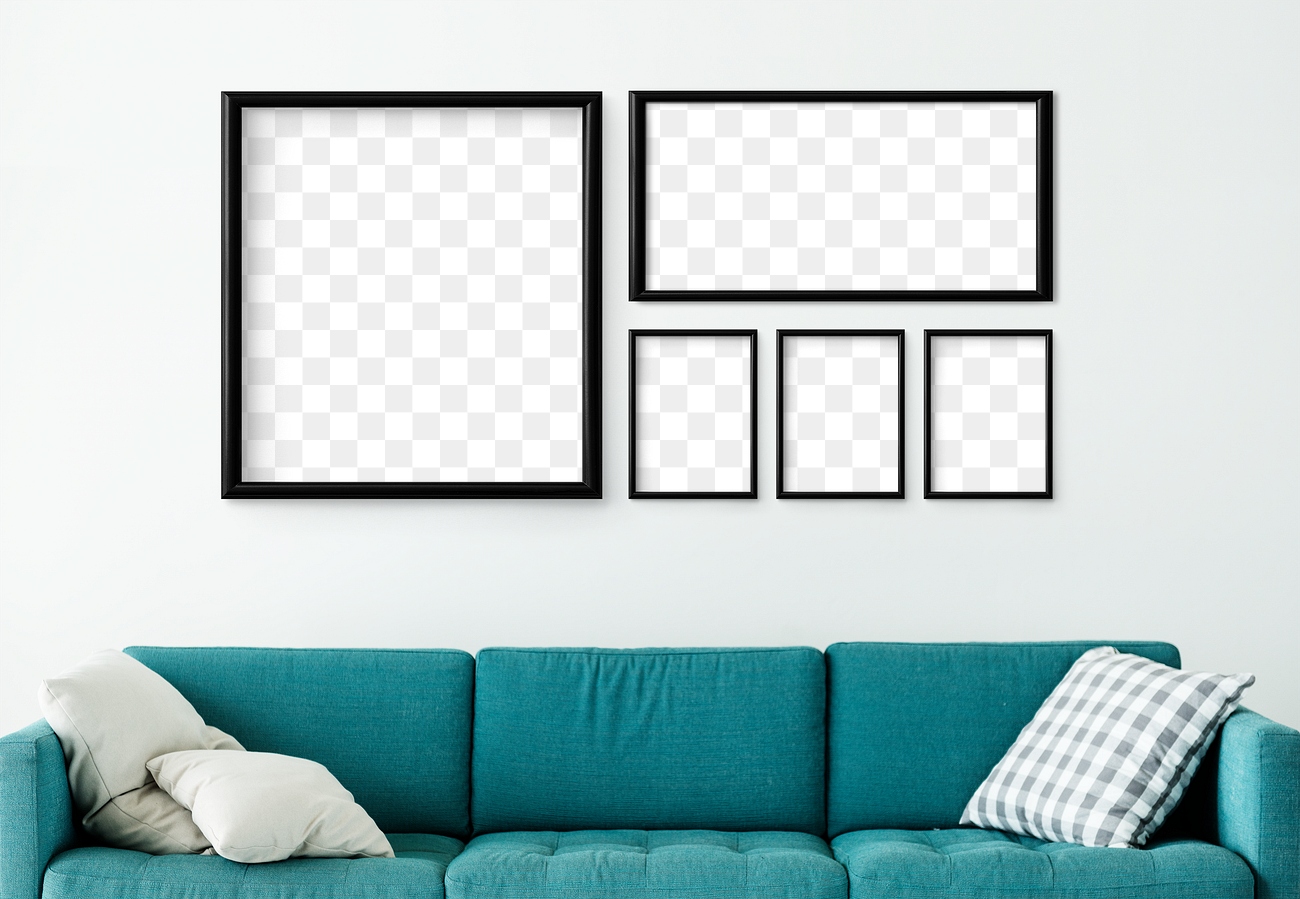 5 blank black picture frames hanging in a white living room 