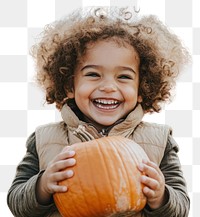 PNG Child holding pumpkins hair outdoors smiling.