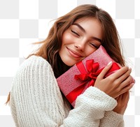 PNG A woman is hugging her Christmas present sweater background ribbon.