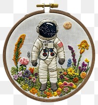 PNG  An astronaut embroidery pattern representation.