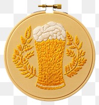 PNG A beer in embroidery style textile gold representation.
