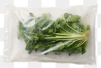 PNG  Plastic wrapping over a vegetable spinach plant food.