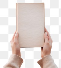 PNG A person holding a book sea outdoors nature. AI generated Image by rawpixel.