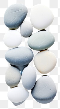 PNG Flat lay rocks sitting on top of a white surface backgrounds pebble pill. AI generated Image by rawpixel.