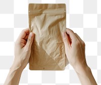 PNG Person holding paper coffee bag wood hand indoors.
