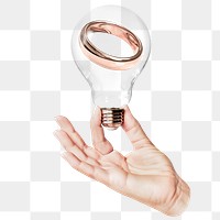 Wedding ring png sticker, hand holding light bulb in marriage concept, transparent background