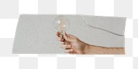 Png hand holding light bulb tape sticker, transparent background