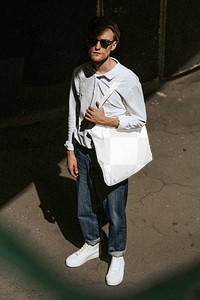Tote bag png transparent mockup, male model