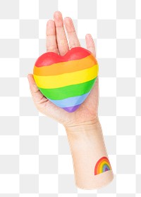 Rainbow heart png sticker in hands, transparent background