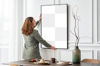 Picture frame png mockup, woman decorating wall, transparent design