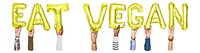 Eat vegan word png, hands holding balloon typography, transparent background