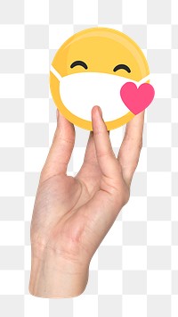 Png hand holding smiley emoticon wearing mask, transparent background