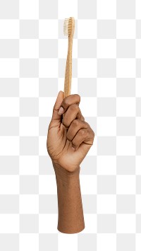 Hand holding png bamboo toothbrush, transparent background