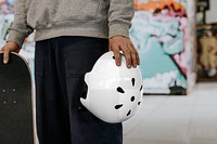 PNG helmet mockup transparent, sports safety equipment, held by man