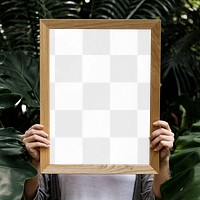 Wooden picture frame png mockup held by woman