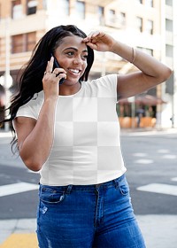 Png crop top mockup worn by a woman walking in the city street style apparel