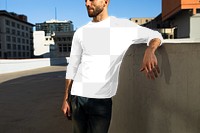 Png men&rsquo;s tee apparel mockup on a man in the city street style fashion