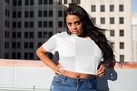 Png crop top mockup worn by a woman on the rooftop
