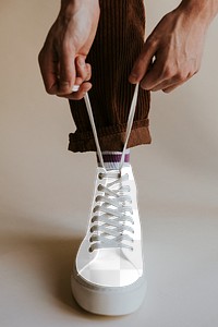 Man tying shoelaces png mockup