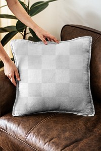 Cushion mockup png with transparent background on a leather couch