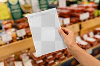 Paper png mockup transparent, held by a woman doing grocery shopping