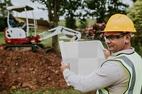 Contractor with plan png mockup at a construction site