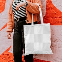 Tote bag png mockup reusable canvas bag carried by a model 