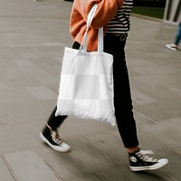 Tote bag png mockup reusable canvas bag carried by a model 