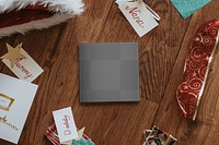 Christmas card png mockup, on wooden floor, festive stationery