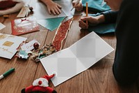 Christmas card png mockup, on wooden floor, festive stationery