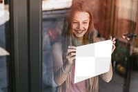 Sign png mockup, girl showing paper through glass window