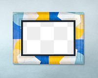 Frame PNG mockup, colorful pattern on blue wall