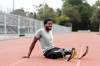 Tops mockup png on paralympic athlete with prosthetic legs warming up by stretching before exercising