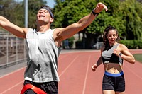 Man runner winnning with arms open, athletic race competition