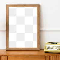 Picture frame mockup on a wooden sideboard table with a typewriter 
