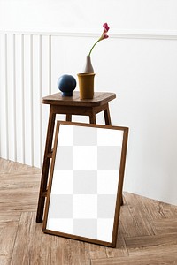 Picture frame mockup by a wooden stool