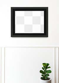 Black picture frame mockup hanging on a white wall
